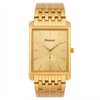 A gold-tone stainless steel wrist watch with a rectangular bezel, matching gold dial, and integrated link bracelet, featuring the brand name 'Hennex' on the dial.