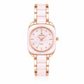 A women's analog watch with a square case, a light pink ceramic dial and link bracelet, and rose gold-tone metal accents, including a crown and crystal hour markers. The brand name 'THE TIME SQUARE' is printed on the dial.