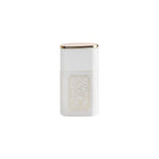A white rectangular cosmetic container with a gold-foiled map design on the front and a gold-trimmed lid, shown on a plain white background.