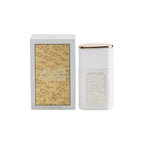 A white cylindrical perfume bottle with a gold cap stands next to its matching white box, which features gold Arabic calligraphy, on a plain white background.