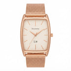 A Discovery Slim rectangular analog watch with a rose gold-tone metal mesh strap and a cream-colored dial, shown against a plain white background.