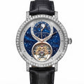 A luxury wristwatch by Lange & Söhne, featuring a silver-tone case encrusted with clear stones, a black leather strap, and a detailed blue galaxy-patterned dial with a visible gold-toned tourbillon.