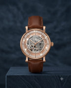 A luxury Timex skeleton watch with a brown leather strap, rose gold case, and a crystal-encrusted dial, displayed on a dark textured background.