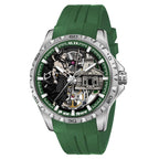 A luxury skeleton watch by ALIX with a green silicone strap, a silver stainless steel case, and a detailed skeleton dial showing a mechanical movement and a figure.