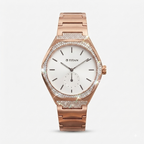 Titan women's watch featuring a rose gold metal case and bracelet, a white dial with slim black indices, and a bezel and lower case accent encrusted with clear pavé stones, shown on a light gray background.