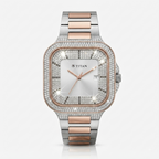 A two-tone stainless steel and rose gold watch by TITAN, featuring a square bezel paved with clear crystals, a white dial with rose gold hands, and a matching two-tone link bracelet.