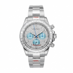 A luxury wristwatch with a silver-tone stainless steel case and bracelet, heavily embellished with clear crystals. The dial is also crystal-covered with light blue subdials and blue hands, and features red text accents including 'Henry Dato' and '1904L'.