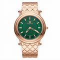 A wrist watch with a textured rose gold-tone metal case and integrated link bracelet, featuring a green textured dial with gold-tone hands and hour markers. The brand name 'TIME SQUARE' is printed on the dial.