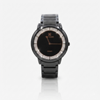 A black ceramic watch with a round bezel lined with clear crystals, black link bracelet, and rose gold-tone hands and branding on the dial.