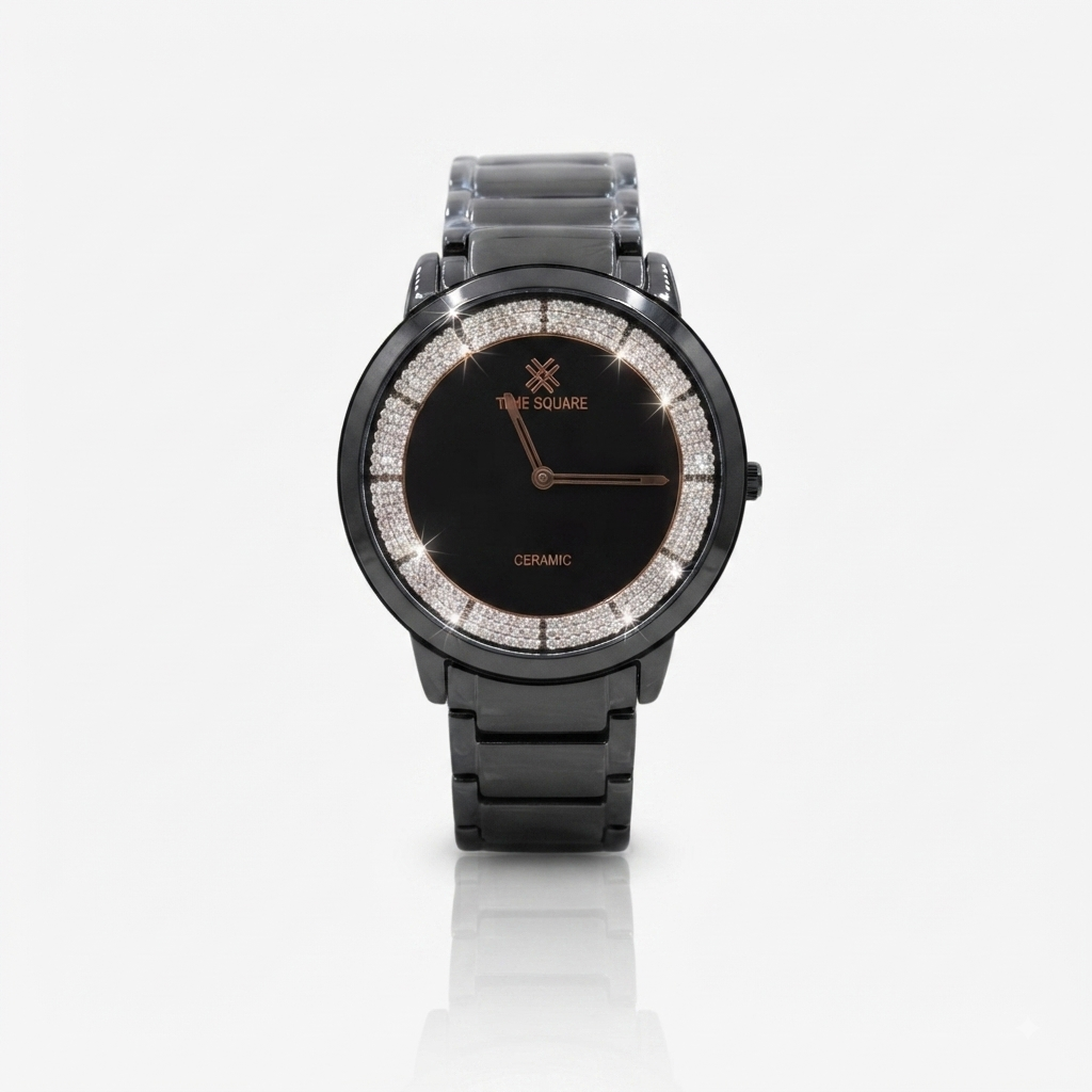 A black ceramic watch with a round bezel lined with clear crystals, black link bracelet, and rose gold-tone hands and branding on the dial.