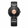 A minimalist ceramic watch by Time Square with a black round dial, rose gold center circle and hands, and a black ceramic link bracelet, shown on a solid white background.