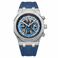 A luxury chronograph watch featuring a brushed stainless steel case, a black dial with blue subdials and silver markers, and a blue silicone strap, shown against a plain white background.