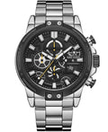 A silver stainless steel chronograph watch with a black dial, featuring white and yellow accents, a date window, and a matching steel link bracelet on a white background.