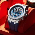 Luxury watch with blue and silver design on a red background