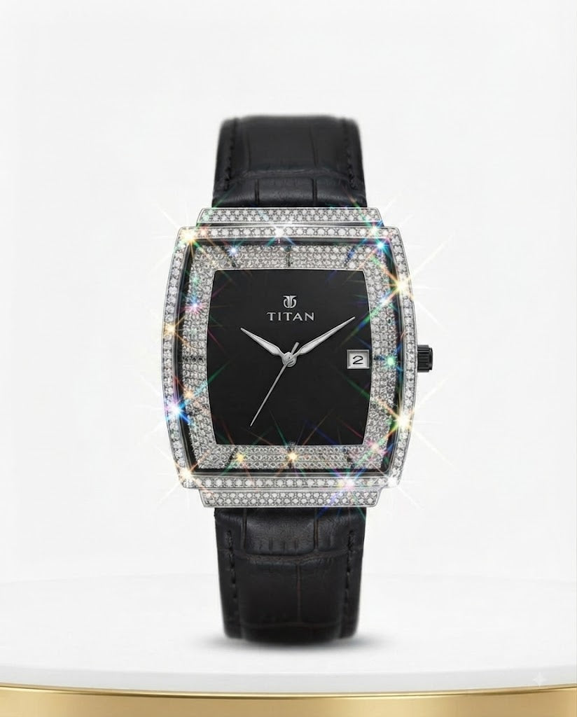 A rectangular women's watch with a black dial, a bezel paved with small clear stones, and a black leather strap, shown on a white background with a gold base.