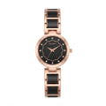 A women's analog watch with a round rose gold case, a black scalloped dial with rhinestone hour markers, and a matching rose gold and black link bracelet, shown against a plain white background.