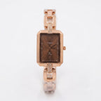 A women's Timex watch with a rose gold-tone metal bracelet and case, featuring a brown dial and crystal embellishments on the bracelet links, shown on a white background.